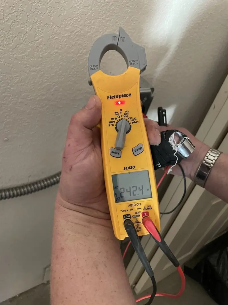 Voltage testing with clamp meter during Recessed Lighting Installation in Nether Providence